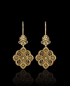 Indulge in the exquisite craftsmanship of these gold-plated 925 sterling silver filigree art flower-shaped women's dangle drop earrings. These stunning earrings are designed with intricate floral details and feature delicate filigree work, creating a stunning visual effect. The earrings measure 1.90 inches in length, 0.90 inches in width, and have a drop length of 0.90 inches. The oxidized finish gives them a unique antique look, and they are highly polished to create a brilliant shine. They com Filigree Gold Jewellery, Drop Gold Earrings, Diamond Finger Ring, Pearl Earrings Designs, Gold Jewellry, Drop Earrings Gold, Jewelry Drawing, Filigree Jewelry, Silver Lace