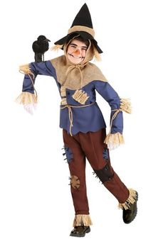 a boy dressed in a scarecrow costume