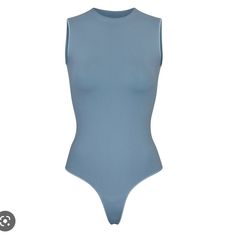 Never Worn Blue High Stretch Bodysuit For Swimming, High Stretch Blue Bodysuit For Swimming, Blue High Stretch Sleeveless Bodysuit, Blue High-stretch Sleeveless Bodysuit, Casual Light Blue Sleeveless Bodysuit, Casual High Stretch Blue Bodysuit, Sleeveless High-stretch Blue Swimwear, Blue Sleeveless Sporty Bodysuit, Sporty Sleeveless Blue Bodysuit