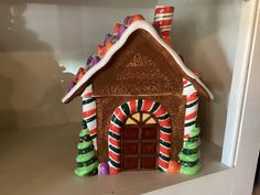 a gingerbread house with candy on the roof