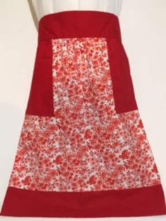 a red and white apron on a mannequin