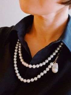 Elevate your style with Pearls Your Way Long Chain Necklace. Adorned with a genuine freshwater baroque pearl pendant, this versatile accessory brings a touch of luxury to any outfit. Wear it long or wrap it for a chic and elegant look. Color: Pearl Made of: 18k gold plated stainless steel with tarnish and water-resistant, Glass pearl beads, Lead and Nichol-free Brand: Ellison and Young Includes: x1 Chain, x1 Genuine Baroque Pearl Pendant Size: Approximately 34" long, no opening Elegant Baroque Pearl Beaded Chain Necklace, White Baroque Pearl Drop Chain Necklace, Luxury Baroque Pearl Necklace With Pearl Chain, Classic Baroque Pearl Chain Necklace, Luxury Baroque Pearl Necklace With Chain, Long Chain Necklace, Long Chain, Baroque Pearls, Pearl Pendant