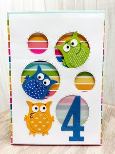 a birthday card with three owls and the number four