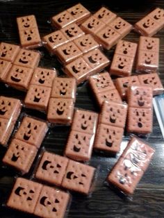 there are many pieces of chocolate with faces on them