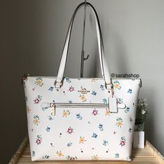 100% Authentic Coach C4251 Wildflower Gallery Tote Chalk Multi And Gold Hardware **Brand New With Tags** Size : 17” L X 11” H X 5.5 D Large Handles With 9” Drop Coach Floral Print Bags For Everyday Use, Elegant Coach Bags With Floral Print, Coach Spring Tote Shoulder Bag, White Floral Print Shopping Bag, White Floral Print Shoulder Bag For Shopping, White Floral Print Tote Bag, White Travel Bags With Floral Embroidery, White Floral Print Tote Shoulder Bag, White Floral Print Shoulder Bag For Travel