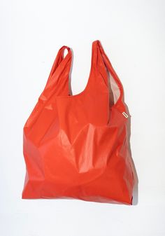 Cordera Hobo Bag in Amapola Red Reversible Shopping Bag, Red Reversible Bag For Shopping, Red Shoulder Bag With Leather Handles For Market, Red Double Handle Shoulder Bag For Market, Red Shoulder Bag With Rolled Handles For Shopping, Red Nylon Shopping Bag, Red Shoulder Bag With Rolled Handles, Red Hobo Bag With Removable Pouch, Orange Hobo Bag With Removable Pouch For Shopping