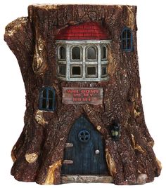 a tree stump with a house built into it