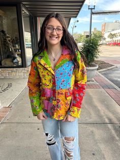 Add a pop of color to your wardrobe with our Kantha Stich Patchwork Blazer! This quirky blazer features a vibrant floral patchwork design, faux pockets, and button closure. Its quilted construction provides both style and warmth. A playful and unique addition to any outfit! Casual Multicolor Outerwear With Floral Patchwork, Spring Multicolor Floral Patchwork Outerwear, Casual Multicolor Blazer With Pockets, Multicolor Quilted Spring Outerwear, Fall Multicolor Floral Patchwork Outerwear, Multicolor Cotton Outerwear With Floral Print, Spring Multicolor Patchwork Blazer, Spring Multicolor Outerwear With Patch Pockets, Multicolor Cotton Blazer For Fall