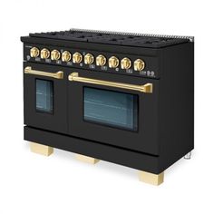 a black and gold stove with two ovens on it's sides, side by side