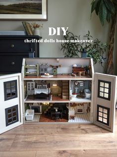 an open doll house with furniture and accessories