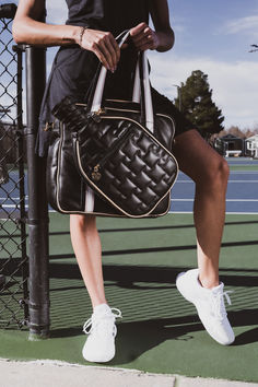 This is more than a bag. It is a versatile companion that seamlessly combines fashion and function. Designed with active women in mind, it features a unique paddle compartment for easy and accessible pickleball equipment storage. The spacious main compartment provides ample room for your essentials and extras, including gym clothes, water bottles, laptop, and more. Elevate your game and experience the perfect fusion of fashion and functionality. Sporty On-the-go Shoulder Gym Bag, Sporty Rectangular Gym Bag With Zipper Pocket, Sporty Duffle Bag For Sports, Sporty Shoulder Travel Bag, Sporty Shoulder Gym Bag, Sporty Shoulder Bag With Zipper For On-the-go, Sporty Shoulder Bag With Zipper Closure For On-the-go, Versatile Sports Duffle Bag, Athleisure Sports Bag