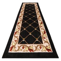 a black and white runner rug with gold trimmings on the bottom, along with an ornate design