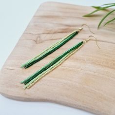 Beaded earrings, Long strand earrings, Dangle earrings, Seed bead earrings, Fringe earrings, Birthday gift for her, Green and gold earrings Beautiful long strand beaded fringe earrings. Made with high quality glass beads. They are perfect for special occasion and everyday use. They will transform your daily outfit into something special and unique. They are perfect for a gift. 4 inch (10 cm) long gold coated ear wires glass beads  high quality thread  other colours available, please send me a me Green Seed Bead Earrings, Green And Gold Earrings, Gold Fringe, Beaded Fringe, Green Earrings, Earrings Long, Birthday Gift For Her, White Earrings, Seed Bead Earrings