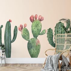 a cactus wall decal next to a wicker chair