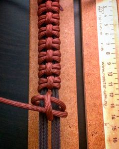 a close up of a rope with a measuring tape next to it