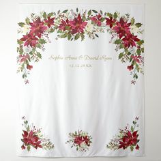 a white wall hanging with poinsettia and flowers on it's side