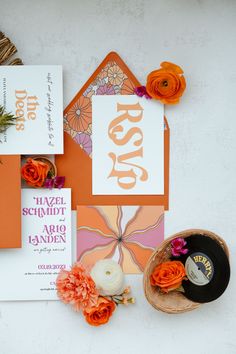 orange and white wedding stationery with flowers