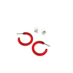 A transparent red lucite hoop earring in a small and narrow size & shape. This is the skinny Tube Hoop & measures about 1" or 25mm in diameter & only 3.5mm in diameter. Super light weight & they go with anything. The look is modern, sleek, and minimalist or can be rocked with any retro inspired style as well. The most versatile earrings we stock. Earrings are made with vintage lucite parts that were made in the US or Europe in the 1960's - early. We hand-set them with surgical steel earring post Small Red Hypoallergenic Hoop Earrings, Trendy Red Hoop Earrings, Trendy Small Red Hoop Earrings, Trendy Red Hoop Earrings For Everyday, Trendy Small Hoop Red Earrings, Hypoallergenic Red Hoop Earrings For Everyday, Everyday Hypoallergenic Red Hoop Earrings, Modern Red Small Hoop Earrings, Modern Small Red Hoop Earrings