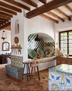 the kitchen is decorated with colorful tiles and wood