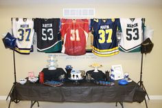 the table is set up with hockey jerseys