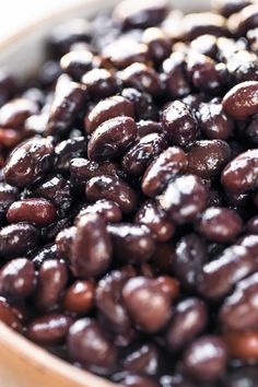 a close up view of some beans in a bowl