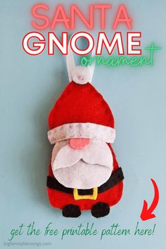 a santa ornament hanging on a wall with the text get the free printable pattern here