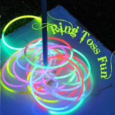 the glow ring tosser is lit up with neon colored rings on top of it