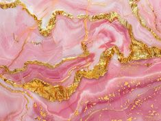 an abstract painting with gold and pink paint on it's surface is shown in full color