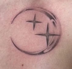 a man's chest with a star and crescent tattoo design on the side of his chest