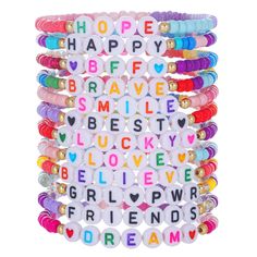 a stack of bracelets with the words happy, brave and love spelled on them