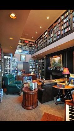 a living room filled with lots of books and furniture