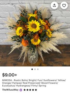 a vase filled with sunflowers and other flowers on top of a wooden table