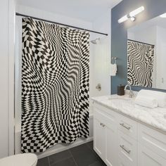 a black and white shower curtain in a bathroom