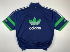 Vintage 90s Adidas Big Logo Spellout Track Top Jacket Blue Green Size L Condition: great Size Tag - L (check measurements) Length - 74cm Pit to Pit - 66cm Please check all Size Details and Photos! I am always open to offers! ______________________________________________ Worldwide: 10-25 business days.  (In rare cases the shipping time more than 25 days) 90s Style Streetwear Track Jacket For Spring, Adidas Blue Track Jacket For Streetwear, 90s Blue Track Jacket For Streetwear, 90s Style Blue Track Jacket For Streetwear, Casual Blue Track Jacket For Streetwear, 90s Style Blue Track Jacket For Fall, Adidas Sporty Crew Neck Outerwear, 90s Blue Sports Outerwear, 90s Style Blue Sports Outerwear