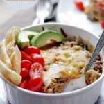 a white bowl filled with pasta and veggies