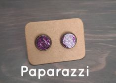 Purple in color with holographic shimmers.  Made from a Stainless Copper material Earring stud. The backing and the earring stud are a gunmetal color. The center is filled with resin and  colorful shimmers. Each set is handmade and may have imperfections. Glitter Round Earrings For Gifts, Purple Glitter Earrings For Gift, Purple Glitter Jewelry Gift, Purple Glitter Jewelry For Gifts, Glitter Stud Earrings, Purple Resin, Resin Glitter, Accessory Jewelry, Earring Stud