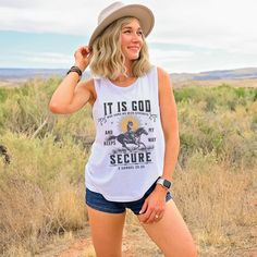 Get ready to be OBSESSED with your new 'It Is God' Bible verse, vintage boho western tank top. It's the cutest and most trendy way to emit all those important trendy, western Christian vibes! This is the perfect tank for Christians, boho cowgirls, Nashville girls trips, country concerts, rodeo events, or music festivals and makes a great gift for Christian/Religious clothing and fashion lovers! Please note: We have intentionally added a distressed effect to your tshirt, to give it a more aged/re Bohemian Graphic Print Rodeo Top, Bohemian Graphic Print Tops For Rodeo, Western Tops For Country Concerts In Summer, Western Style Tank Top For Summer Rodeo, Western Sleeveless Tank Top For Rodeo, Western Style Sleeveless Tank Top For Rodeo, Western Style Sleeveless Cotton Top, Western Style Sleeveless Tops For Spring, Sleeveless Western Tops For Spring