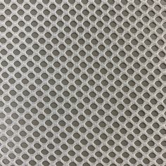 an image of a metal surface with circles and dots in grey tones, as well as the