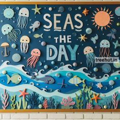 an ocean themed bulletin board with sea animals and words that say, seas the day