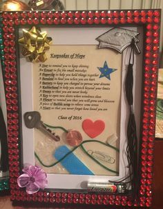 a frame with a key and ribbon on it that has a poem in the middle