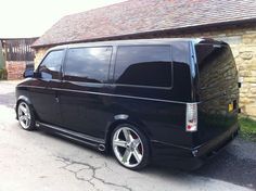 a black van parked in front of a house