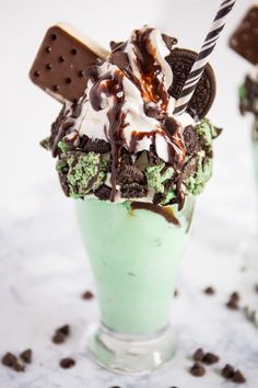 an ice cream sundae with oreo cookies and mint green tea milkshake