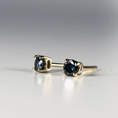 "14k yellow gold and blue diamond stud earrings. They will make a great companion to your beautiful wedding. They are very elegant for daily use or for official gatherings. SOLD AS PAIR. Material; 14k solid gold studs Round blue diamonds are 3mm Prong settings. 14k gold backings included. On the pictures you see 14k solid gold hammered bar studs are available from this link; https://www.etsy.com/listing/953435550/14k-gold-hammered-bar-stud-earrings-tiny? Matching ring is available here https://w Sapphire Earrings With Ethical Diamonds For Anniversary, Blue Diamond Cut Earrings As A Gift, Yellow Gold Sapphire Diamond Earrings For Anniversary, 14k Gold Sapphire Earrings For Anniversary, Anniversary Sapphire In Yellow Gold Diamond Earrings, Anniversary Yellow Gold Sapphire Diamond Earrings, Blue 14k Gold Earrings For Wedding, Modern Blue 14k Gold Earrings, Anniversary Yellow Gold Sapphire Earrings