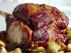 a close up of meat and potatoes on a plate