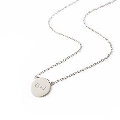 The perfect personalized gift for anyone - engrave your own initial with a loved one's initial. This pendant necklace features a small classic round disc on a delicate, diamond-cut cable chain from our signature O Collection. Disc diameter 0.4in (1cm) Adjustable chain: 15-17in (38-43cm) Laser Engraving Letter Height: 2mm Gold Vermeil Spring clasp closure Hypoallergenic, lead and nickel free #256S Minimalist Round Disc Initial Necklace As Personalized Gift, Silver Adjustable Round Initial Necklace, Minimalist Silver Round Disc Initial Necklace, Sterling Silver Initial Necklace On Round Disc, Sterling Silver Round Disc Initial Necklace, Disc Necklace, Diamond Cut, Cable Chain, Gold Vermeil