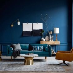 a living room with blue walls and furniture