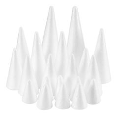 white plastic cones are lined up on a white background, with one cone in the middle