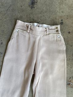 "Vintage 1950s H Bar C Ranchwear Knit Pearl Snap Side Zip Pants. Light lavender in color made from 100% cotton fibers. Pants feature a side button and zip closure. Front pockets have pearl snap accents. Condition overall is good with no major flaws. Pants do have some light fading throughout. No rips, tears, or staining. Please see all photos for details. Refer to measurements below to ensure a proper fit 11\" across waist 14\" hip to hip 10.5\" rise 23\" inseam" Cotton Bottoms With Button Closure For Daywear, Vintage Beige Bottoms With Belt Loops, Retro Cotton Bottoms With Buttons, Cotton Wide-leg Bottoms With Snap Buttons, Cotton Wide Leg Bottoms With Snap Buttons, Wide Leg Cotton Bottoms With Snap Buttons, Vintage Fitted Beige Bottoms, Fitted Vintage Beige Bottoms, Vintage Beige Bottoms For Workwear