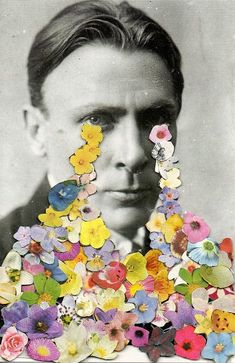 an old black and white photo with flowers in the shape of a man's face