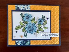 a birthday card with blue flowers on it